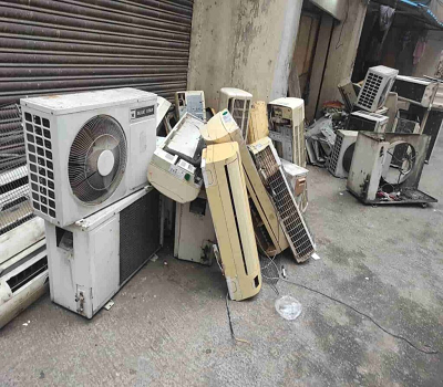 Technician checking AC compressor copper health
